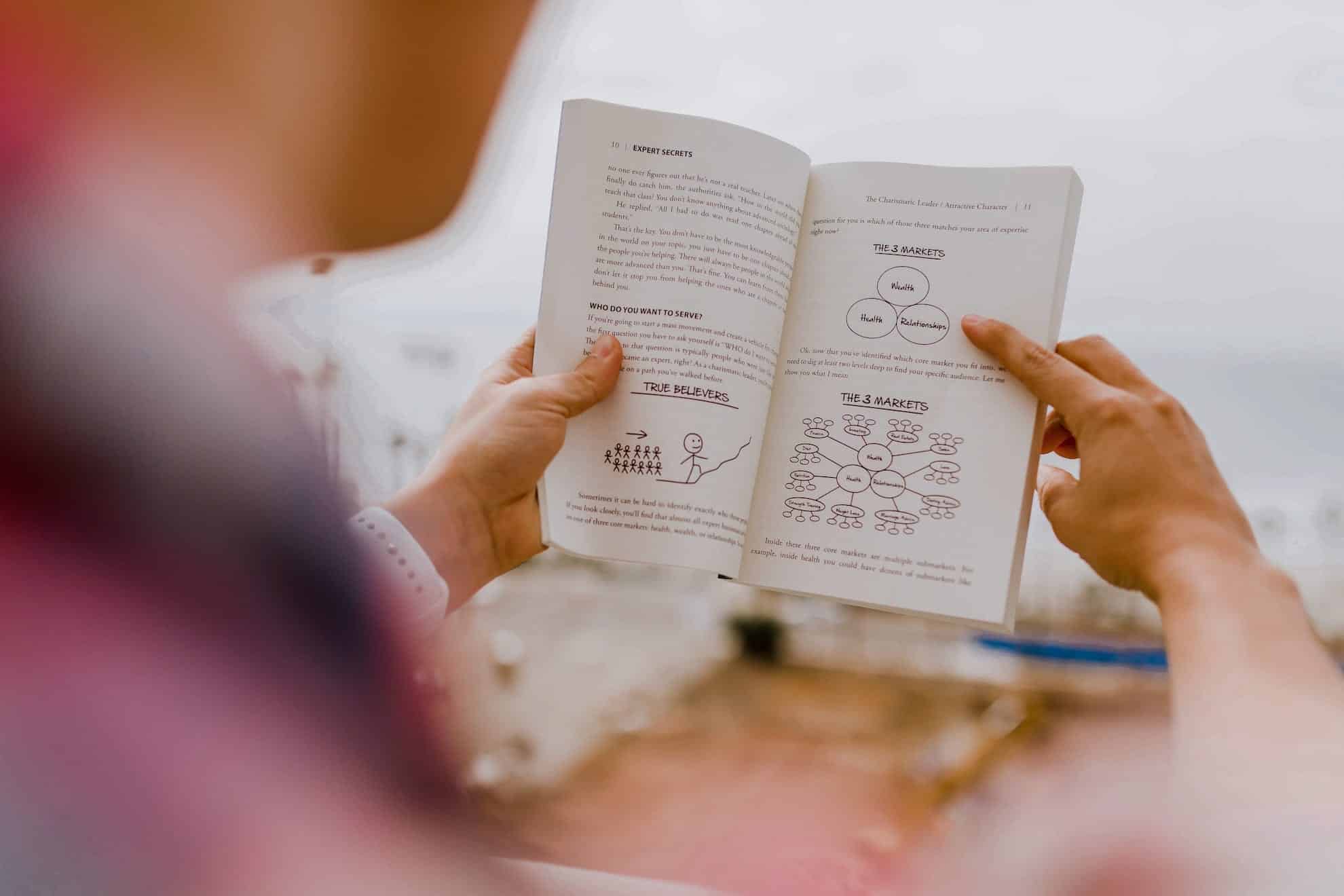 person reading leadership book